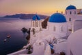 Oia village Santorini with blue domes and whitewashed house during sunset at the Island of Santorini Greece Royalty Free Stock Photo