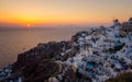 Oia village Santorini with blue domes and whitewashed house during sunset at the Island of Santorini Greece Royalty Free Stock Photo