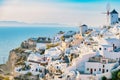 Oia village Santorini with blue domes and whitewashed house during sunset at the Island of Santorini Greece