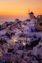 Oia village Santorini with blue domes and whitewashed house during sunset at the Island of Santorini Greece Royalty Free Stock Photo