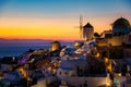 Oia village Santorini with blue domes and whitewashed house during sunset at the Island of Santorini Greece Royalty Free Stock Photo