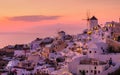 Oia village, Santorini, Greece. View of traditional houses in Santorini. Small narrow streets and rooftops of houses, churches and Royalty Free Stock Photo