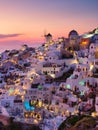 Oia village, Santorini, Greece. View of traditional houses in Santorini. Small narrow streets and rooftops of houses, churches and Royalty Free Stock Photo