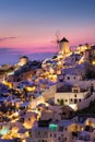 Oia village, Santorini, Greece. View of traditional houses in Santorini. Small narrow streets and rooftops of houses, churches and Royalty Free Stock Photo