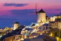 Oia village, Santorini, Greece. View of traditional houses in Santorini. Small narrow streets and rooftops of houses, churches and Royalty Free Stock Photo