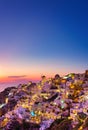 Oia village, Santorini, Greece. View of traditional houses in Santorini. Small narrow streets and rooftops of houses, churches and Royalty Free Stock Photo