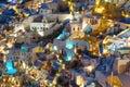 Oia village, Santorini, Greece. View of traditional houses in Santorini. Small narrow streets and rooftops of houses, churches and Royalty Free Stock Photo