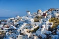 Oia village, Santorini, Greece. View of traditional houses in Santorini. Small narrow streets and rooftops of houses, churches and Royalty Free Stock Photo