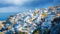 Oia village, Santorini, Greece. View of traditional houses in Santorini. Small narrow streets and rooftops of houses, churches and Royalty Free Stock Photo