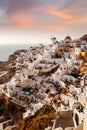 The Oia village on Santorini island in Greece during beautiful sunset with colorful clouds. Royalty Free Stock Photo