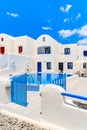 OIA VILLAGE, SANTORINI ISLAND - MAY 23, 2016: Typical greek style apartment hotel with pool in Oia village, Santorini island, Royalty Free Stock Photo