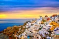 Oia village, windmills, Santorini island, Greece at colorful sunset Royalty Free Stock Photo