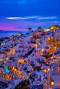 Oia village, windmills, Santorini island, Greece at colorful sunset Royalty Free Stock Photo