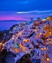 Oia village, windmills, Santorini island, Greece at colorful sunset Royalty Free Stock Photo
