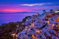 Oia village, windmills, Santorini island, Greece at colorful sunset Royalty Free Stock Photo