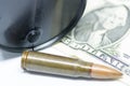 Oil barrel one dollar bill and bullets oil industry war for resources concept