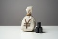 Oil barrels and japanese yen money bag. Buying futures for sale.