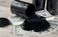 Oil barrels and poured money dollar currency. bargaining. Exchange. oil business