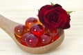 Oil bath pearls and fresh rose Royalty Free Stock Photo
