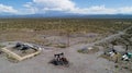 Oil Battery Gathering & Distribution System. Gas oil distribution station with cisterns on a yellow field with pumps pumping oil