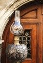 Oil beautiful lamp at an old door. Lviv interior.