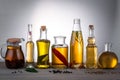 Oil in bottles with butter, olive oil with herbs and spices on the table