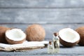 Oil in bottles with coconuts Royalty Free Stock Photo