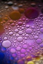 Oil bubbles in water . orange, red and purple colors. Royalty Free Stock Photo