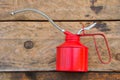 Oil can on wooden background, Lube oil can and used in industry or hard works