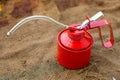 Oil can on wooden background, Lube oil can and used in industry or hard works