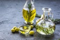 Oil in carafe with spices and olive on stone background mock-up