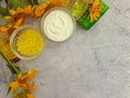 Oil cosmetic soap accessories  health  aromatherapy   calendula flower on concrete background Royalty Free Stock Photo