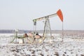 Oil derrick pump jack. Bashkortostan, Russia. Winter