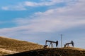 Oil derrick pumps on the prairies, Rockyview Country, Alberta, Canada Royalty Free Stock Photo