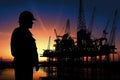 Oil Drill, field pump jack silhouette with setting sun and worker.Refinery, natural gas. Lens Flare. Generative AI