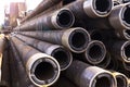 Oil Drill pipe. Rusty drill pipes were drilled in the well section. Downhole drilling rig. Laying the pipe on the deck. View of