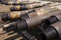 Oil Drill pipe. Rusty drill pipes were drilled in the well section. Downhole drilling rig. Laying the pipe on the deck. View of