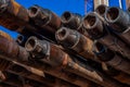 Oil Drill pipe. Rusty drill pipes were drilled in the well section. Downhole drilling rig. Royalty Free Stock Photo