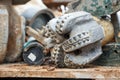 Oil drilling equipment for workover. Used oil drilling bit head. Tricone Oil Drill Bits. Worn out PDC drilling bit just pulled out Royalty Free Stock Photo