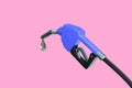 Oil dripping from a gasoline pump isolated on pink background - 3D Rendering.Fuel nozzle with hose fuel pump.Gas pump with drop of