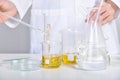 Oil dropping, Chemical reagent mixing, Laboratory and science experiments, Formulating the chemical for medical research Royalty Free Stock Photo