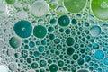 Oil drops on the water - Abstract background green macro photography Royalty Free Stock Photo