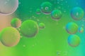 Defocused green defocused abstract background picture made with oil, water and soap Royalty Free Stock Photo