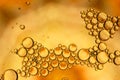 Oil drops on water yellow gold colors Royalty Free Stock Photo
