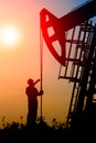 Oil field, the oil workers are working Royalty Free Stock Photo