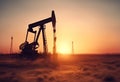 oil field pumpjack sunset Royalty Free Stock Photo
