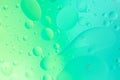 Oil floating on water macro photography abstract green color background Royalty Free Stock Photo