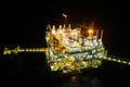 Oil and gas construction in night view. View from helicopter night flight. Oil and gas platform in offshore. Royalty Free Stock Photo