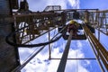 Oil and Gas Drilling Rig onshore dessert with dramatic cloudscape. Oil drilling rig operation on the oil platform in oil and gas