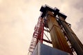 Oil and Gas Drilling Rig onshore dessert with dramatic cloudscape. Oil drilling rig operation on the oil platform in oil and gas